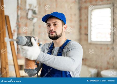 Confident Builder Posing On Indoor Construction Site Stock Image