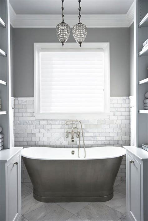 This bathroom uses grey glass tiles to cover the backsplash and walls. 39 light gray bathroom tile ideas and pictures
