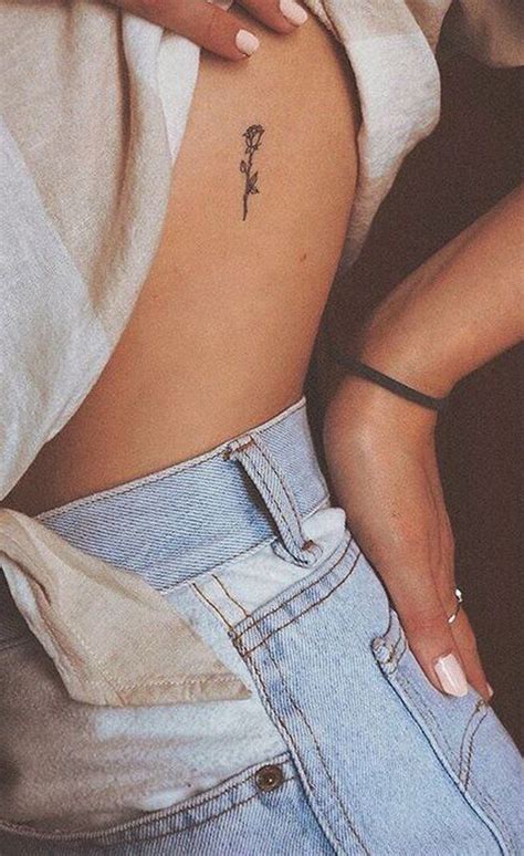 30 Simple And Small Flower Tattoos Ideas For Women Rose Rib Tattoos Rib Tattoo Tattoos