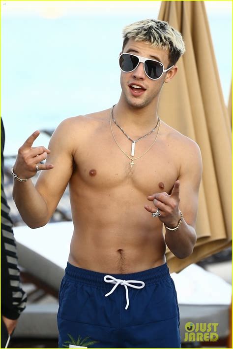 cameron dallas goes shirtless for new year s eve beach day photo