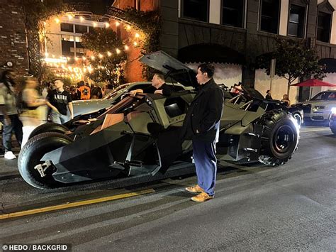 diddy transforms into batman as he arrives at halloween party in a batmobile while chloe bailey