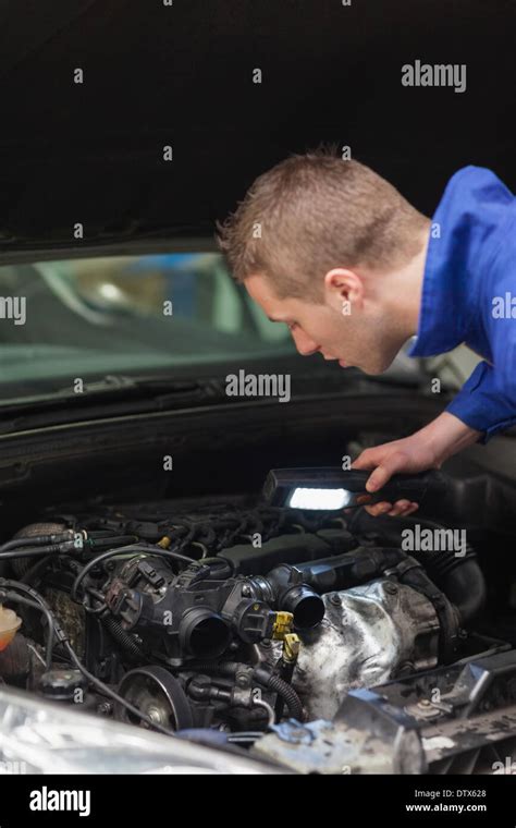 Repairman Examining Car Engine Stock Photo Alamy