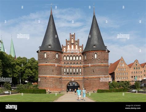 The Holstentor Holstein Gate Is A City Gate That Borders The Old