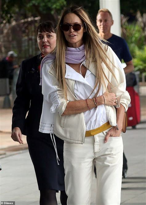 elle macpherson 54 flaunts figure in a white ensemble in sydney elle macpherson winter