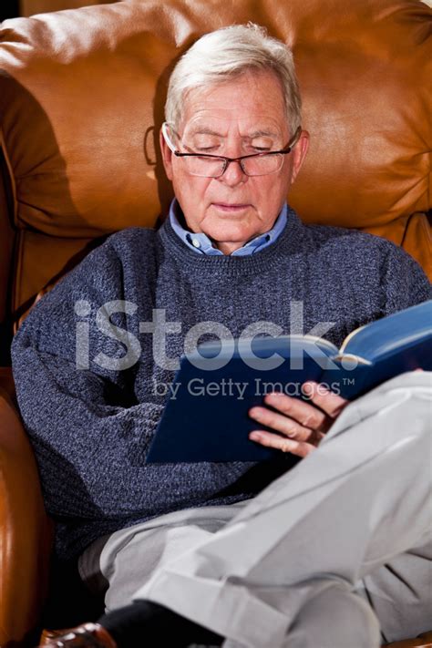 Senior Man Reading In Armchair Stock Photo Royalty Free Freeimages