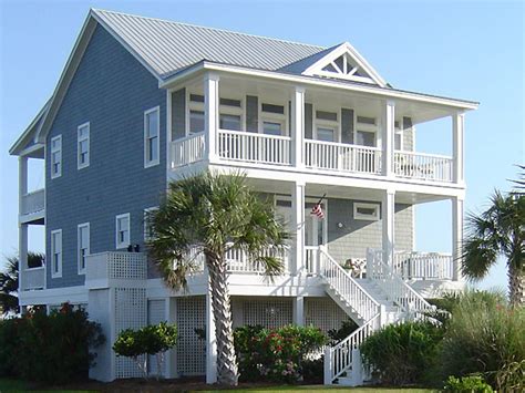 Great outdoor spaces are as must for a waterfront house. Beach Cottage House Plans On Pilings Beach House Plans Narrow, coastal house plans with porches ...