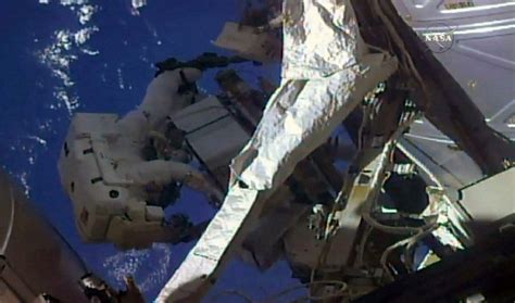 Russian Spacewalkers Take Sample Of Mystery Hole At Space Station