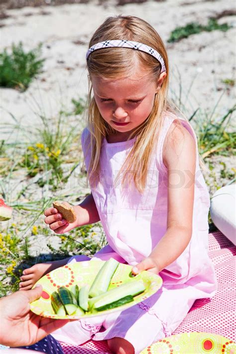 A Caucasian Girl Eating Fresh Cucumber Stock Image Colourbox