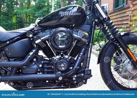 Harley Davidson Motorcycle Stands On A Street Harley Davidson Is An