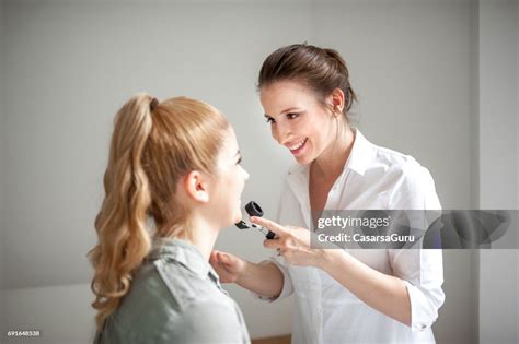 Dermatologist Inspecting Patient Face Skin With Dermatoscope High Res