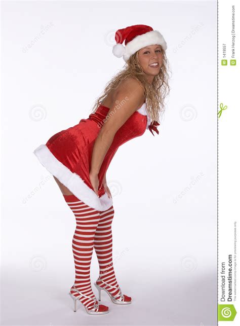 Sexy Kerstman In Rode Kleding Met Het Gestripte Buigen Van Kousen Stock