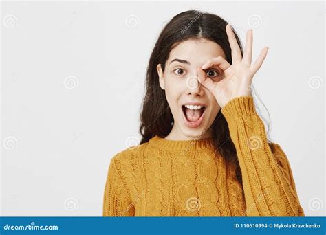 Close Up Portrait Of Excited Happy Caucasian Female Student Showing