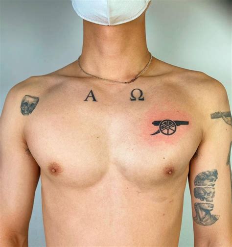 Arsenals Cannon Tattoo Located On The Chest