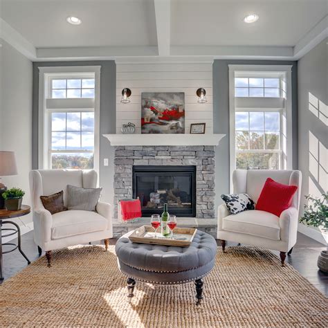 Hearth Room Design Accented By Industrial Open Cage Wall Sconces Above