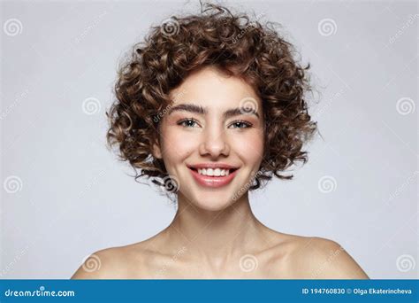 girl with curly hair and ice cream cone in hands royalty free stock image
