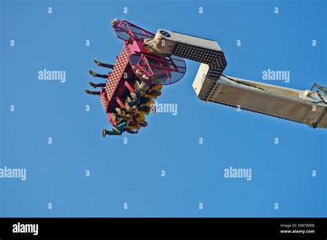 claw which is a ride that spins people upside down a carnival ride on