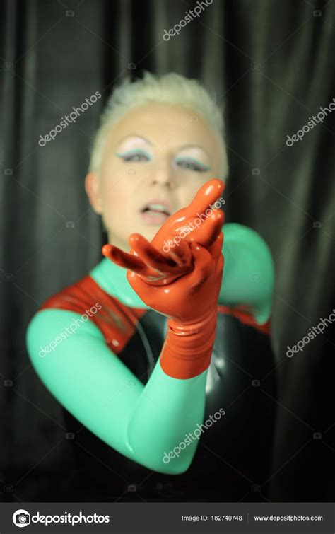 Cute Short Haired Blonde Girl Posing Latex Catsuit Rubber Red Stock