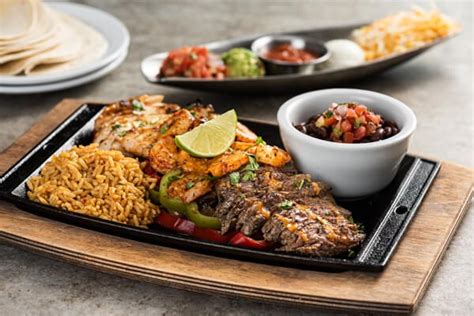 Served with mexican rice, black beans and flour tortillas. Mix & Match Fajita Trio - Grill & Bar Menu | Chili's