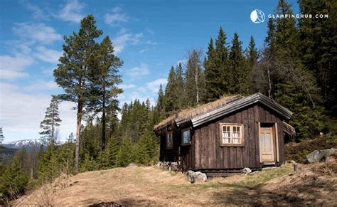 This secluded cabin rental with an indoor fireplace is located in the heart of the tessungdalen forest, in norway, and can accommodate four guests. Secluded Cabin Rental in Tessungdalen Forest, Norway