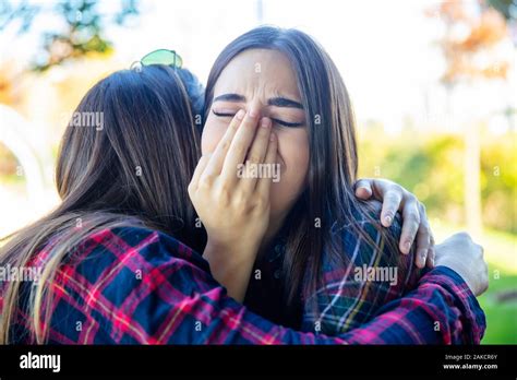 Two Women Sad Comforting Friend Hi Res Stock Photography And Images Alamy