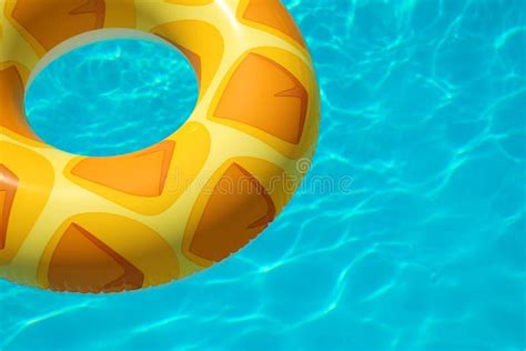 Bright Inflatable Ring Floating In Swimming Pool On Sunny Day Stock