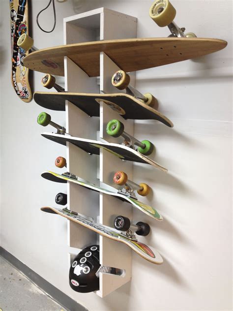 A Skateboard Is Mounted To The Side Of A Wall With Several Shelves On It