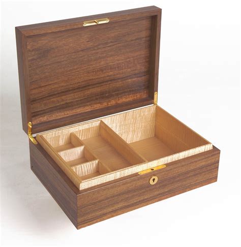 An Open Wooden Box With Three Compartments
