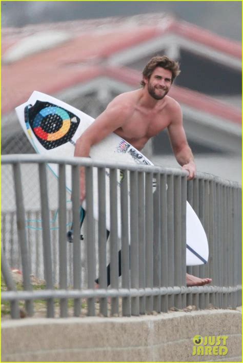 Liam Hemsworth Bares Hot Bod While Stripping Out Of Wetsuit Photo