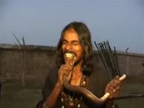 Disgusting Viral Video Of A Man Eating Live Snake Yikes