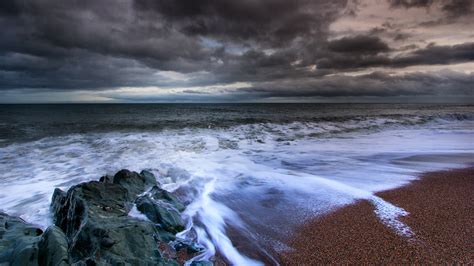 Dark Clouds Over The Ocean Hd Wallpaper Background Image 2048x1152