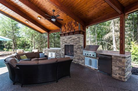 Covered Outdoor Living Area With Grill Refrigerator And Fireplace