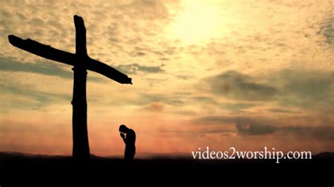 Man Kneeling And Praying At The Cross Videos2worship