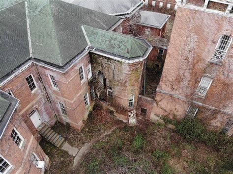 massive hole in the side of kirkbride asylum abandoned places asylum massive