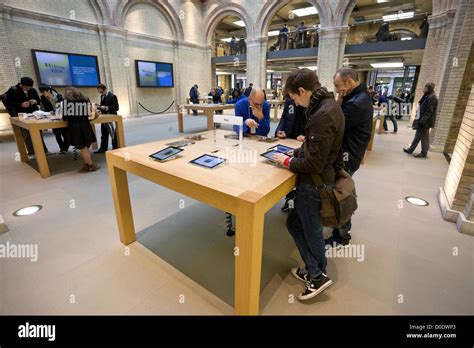 Customers And Ipads At The Apple Store In Covent Garden London