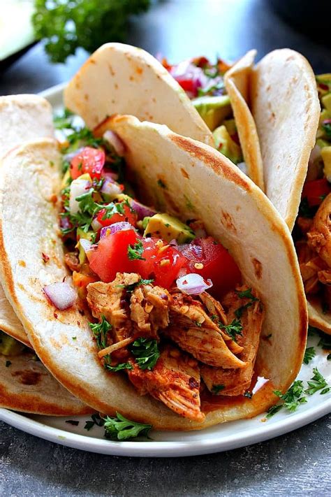 Instant pot chicken tacos, made with seasoned salsa chicken and all the fixings! Instant Pot Chicken Tacos Recipe - Crunchy Creamy Sweet