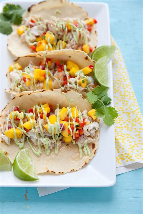 Grill fish until cooked through, about 5 minutes per side. Fish Tacos with Mango Salsa and Avocado Cream Sauce - Everyday Annie