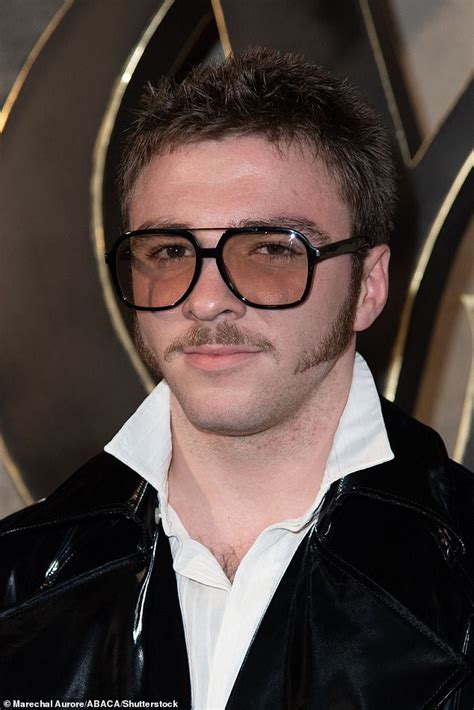 Rocco Ritchie Sports Retro Style Sideburns And Moustache As He Attends The Saint Laurent Show