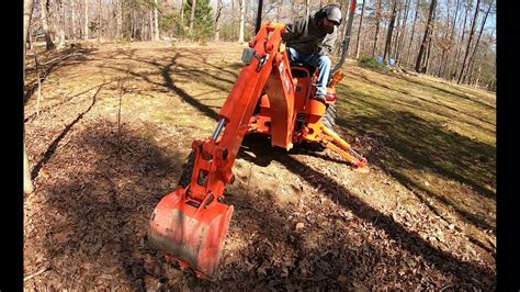 Kubota Bx 25 Tractor First Task Digging Up A Stump Youtube