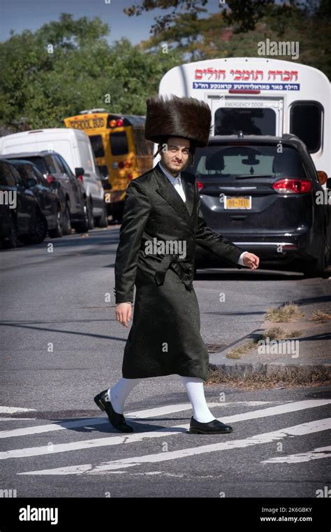 A Hasidic Man Wearing A Shtreimel Fur Hat And High White Stockings