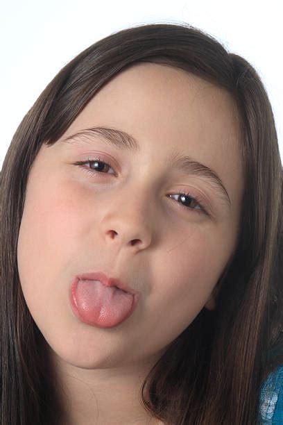 royalty free sticking out tongue human tongue teenage girls mouth open pictures images and