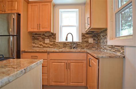 While your backsplash might stain, the materials it. Kitchen remodel with natural maple cabinets, granite ...