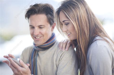 Couple Looking At Smartphone Stock Image F009 7668 Science Photo Library