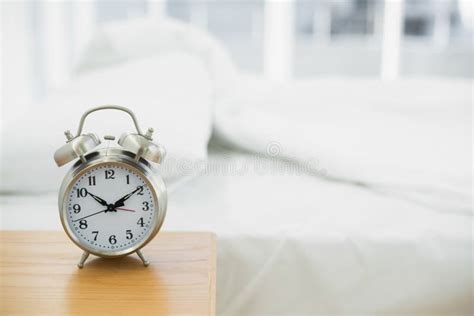 Retro Alarm Clock Standing On A Bedside Table Stock Photo Image Of