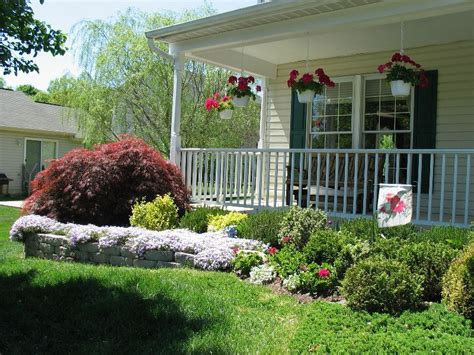 This homeowner has used the space between the sidewalk and his house to this house has a wide range of different colored shrubs to add color to his front yard. Front Yard Design for Ranch Style Homes - HomesFeed