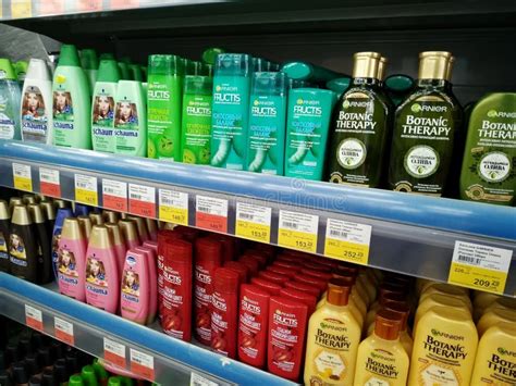 Big Choice Of Various Shampoo On The Shelves Are Sold In A Hypermarket