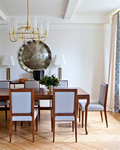 The Dining Room Table Is Surrounded By Chairs