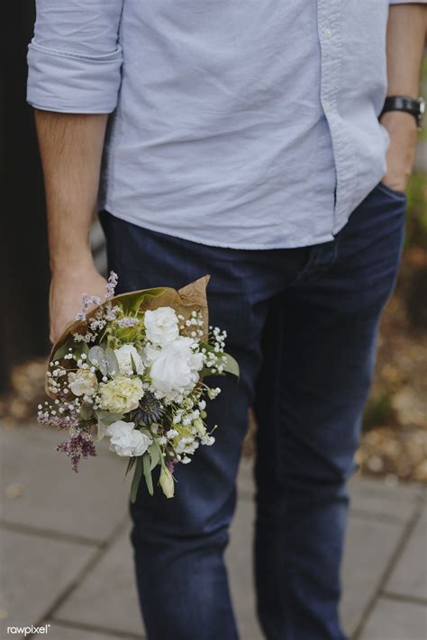 Holding the pipe horizontally, make a hole at the bottom towards of one ends and insert the stop valve. Download premium photo of Man holding a bouquet of flowers ...