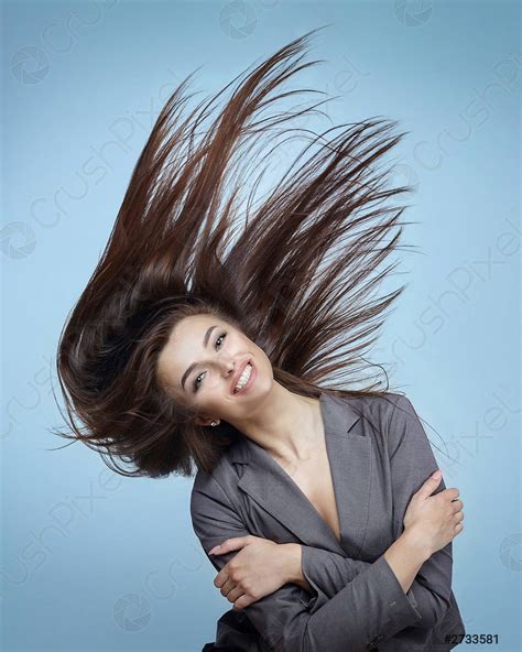 Girl With Flying Hair Poses In A Studio On A Stock Photo Crushpixel