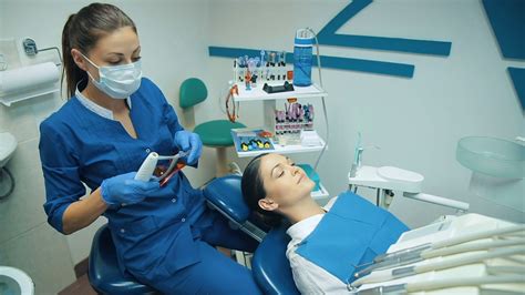 Dentis Puts Dental Fillings With Blue Light Stock Video Footage 0014