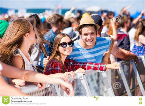 Teenagers At Summer Music Festival Having Good Time Stock Photo Image
